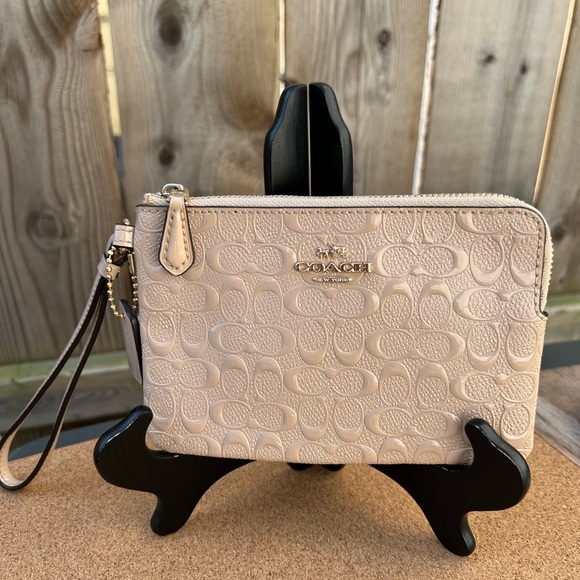Coach Handbags - Coach wristlet color beige